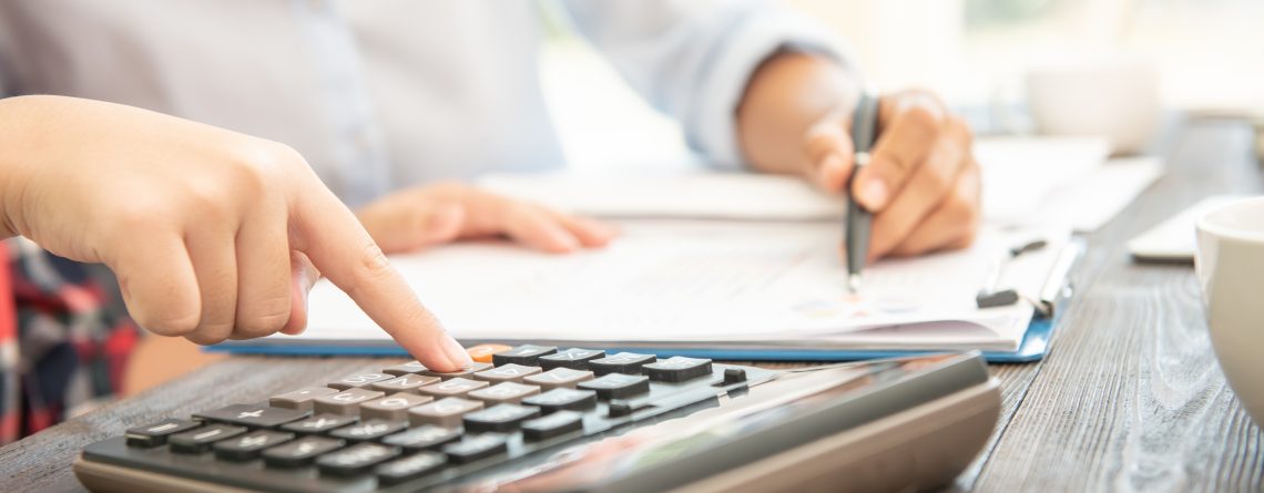 administrator-business-man-financial-inspector-secretary-making-report-calculating-balance-1140x445